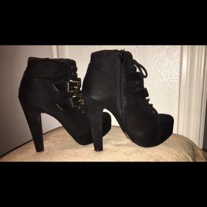 Black velvet ankle boots with gold detailing